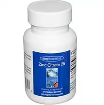A Bottle of Zinc Citrate 2 2, Showcasing Its Label and Contents, Set Against a Neutral Background.