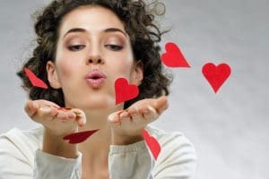 Woman Blowing Hearts